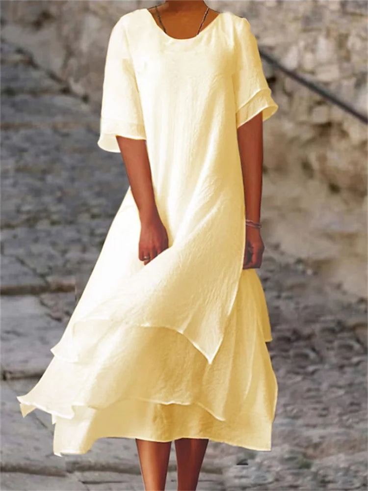 Elegant lang maxikjole til kvinder med rund hals, perfekt til fest eller forår/sommer.