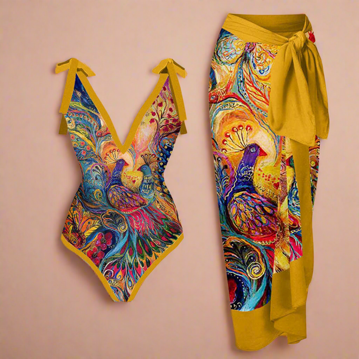Elegant mørkeblåt badetøj og strandsæt til kvinder med detaljeret blomster- og fugleprint, ideelt til strandmode.