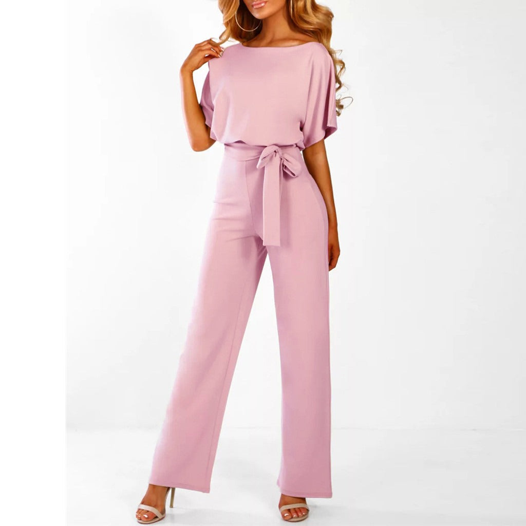 "Elegant mørkeblå kvinders jumpsuit med flatterende silhuet, perfekt til både hverdag og formelle anledninger."