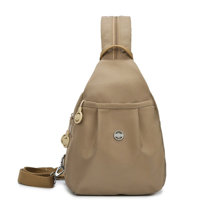 Elegant multifunktionel taske i oxford-stof. Fleksibel stil som crossbody, rygsæk eller skuldertaske.