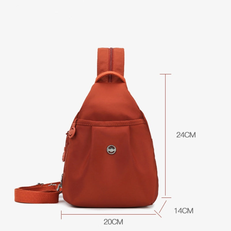 Multifunktionel rejsetaske i oxford-stof. Nemt at skifte mellem rygsæk og crossbody.