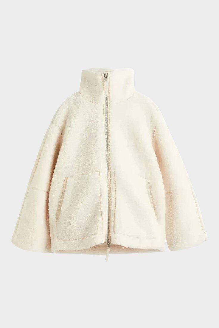 Vintermode damekåbe i varm teddykvalitet, komfortabel og elegant kvindemode.