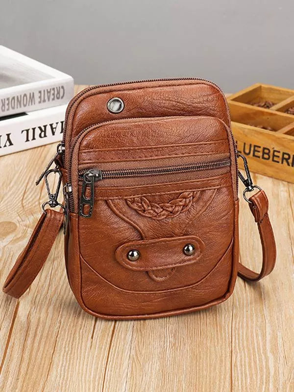 Elegant vintage crossbody-taske til dame i stilfuldt PU læder. Perfekt hverdagstaske.