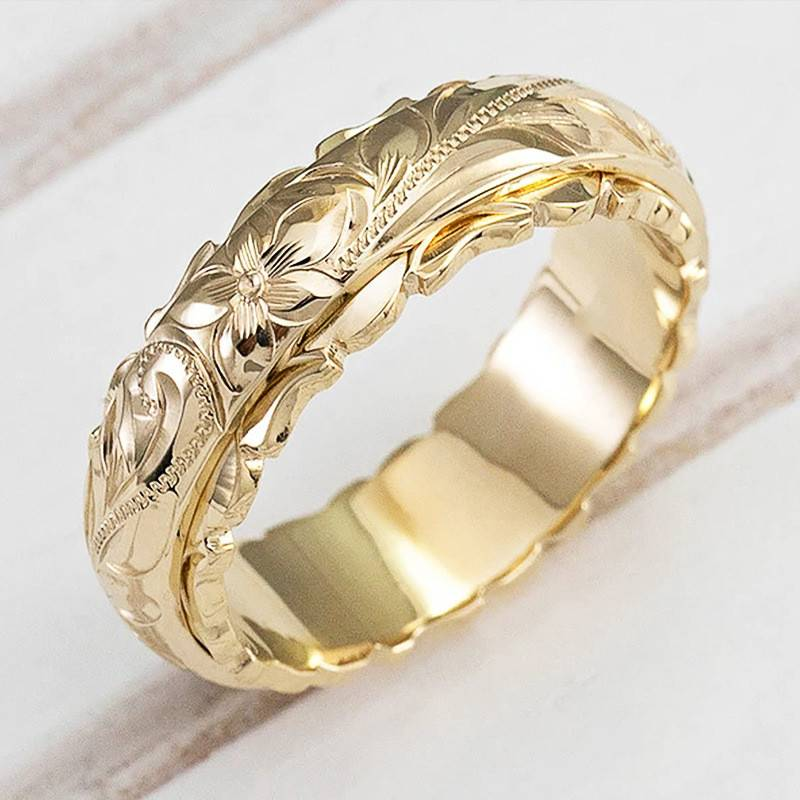 Elegant vintage guldring til kvinder med smukt blomsterdesign, perfekt som fingerring.