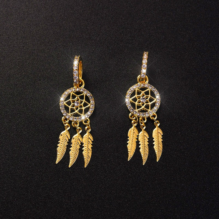 Luksuriøse 14K guldøreringe i drømmefanger design. Perfekt som kvindesmykke og gaveidé.