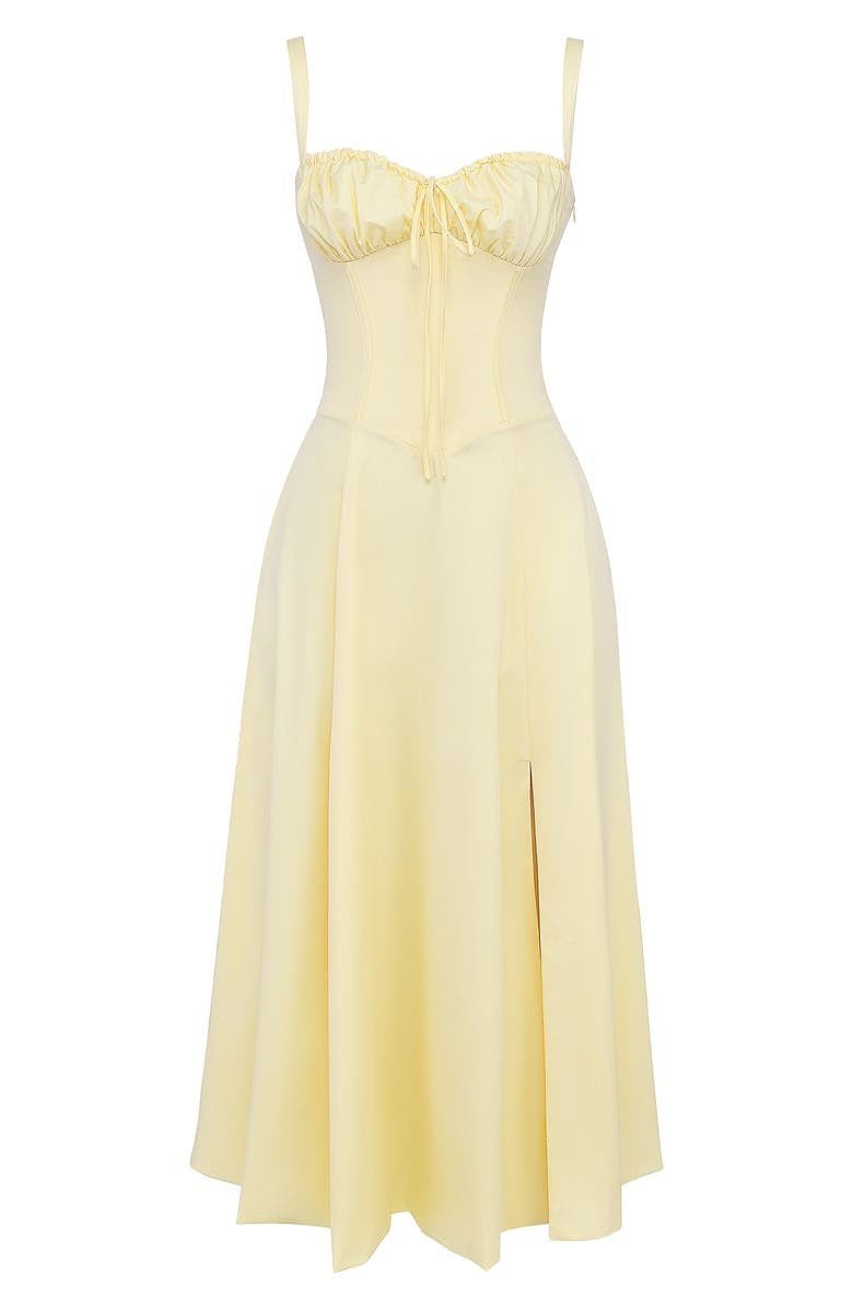 Elegante talje-kjole i champagnefarve med bustier-design og forførende sideslids, ideel til sommerens fester.