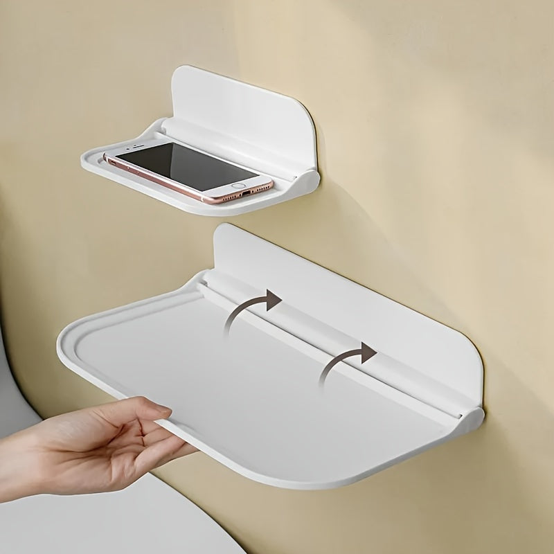 Foldbar væghylde i minimalistisk design, ingen boring nødvendig, perfekt til badeværelse og køkken, pladsbesparende.