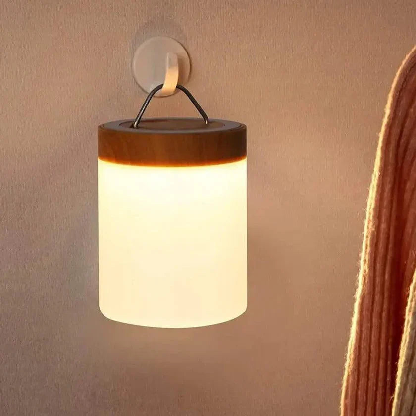 "Genopladelig touch-kontrolleret bordlampe med moderne design, skiftende lysfarver og kompakt bærbarhed."