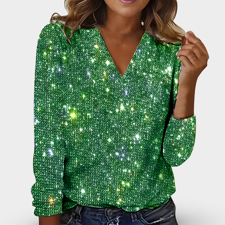 Luksuriøs dame festbluse med V-udskæring, lange ærmer og all-over glimmer. Perfekt til aftenbrug.