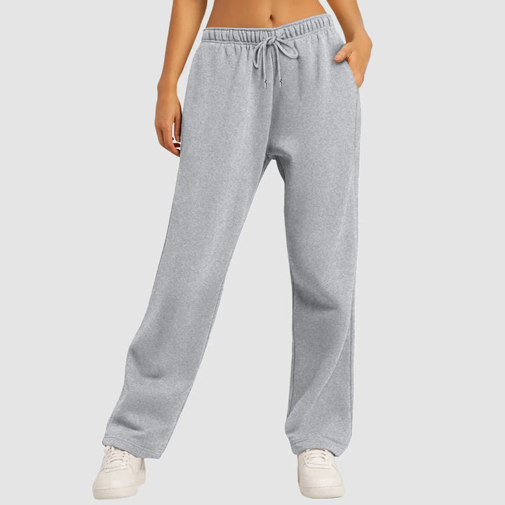 Hvide dame sweatpants med brede ben og høj talje. Disse damebukser er komfortable, trendy og ideelle til fritid.