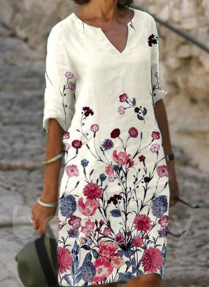 Helmine blomstret kjole til kvinder, elegant og komfortabel sommerfestkjole med farverigt blomstermønster.
