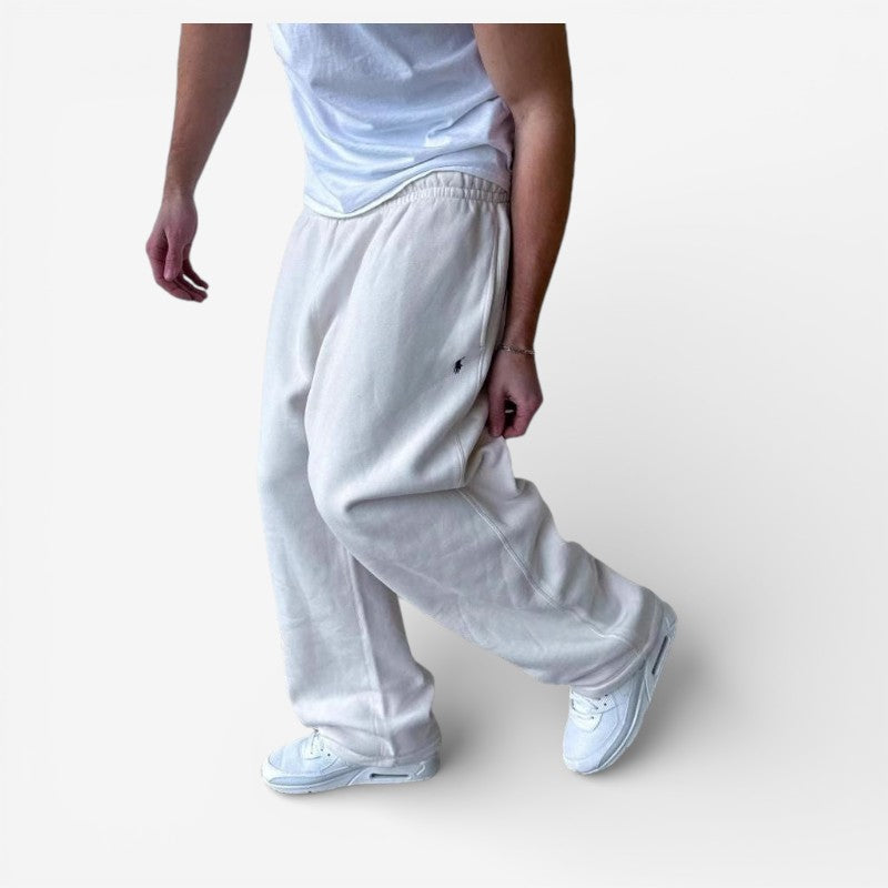 Komfortable fritidsbukser til mænd; højtaljede, med vide ben og sidelommer, ideelle til casual outfits.