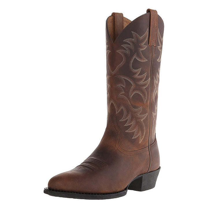 Nærbillede af herre cowboystøvle i sort læder. Detaljeret syning og elegant vestlig stil.