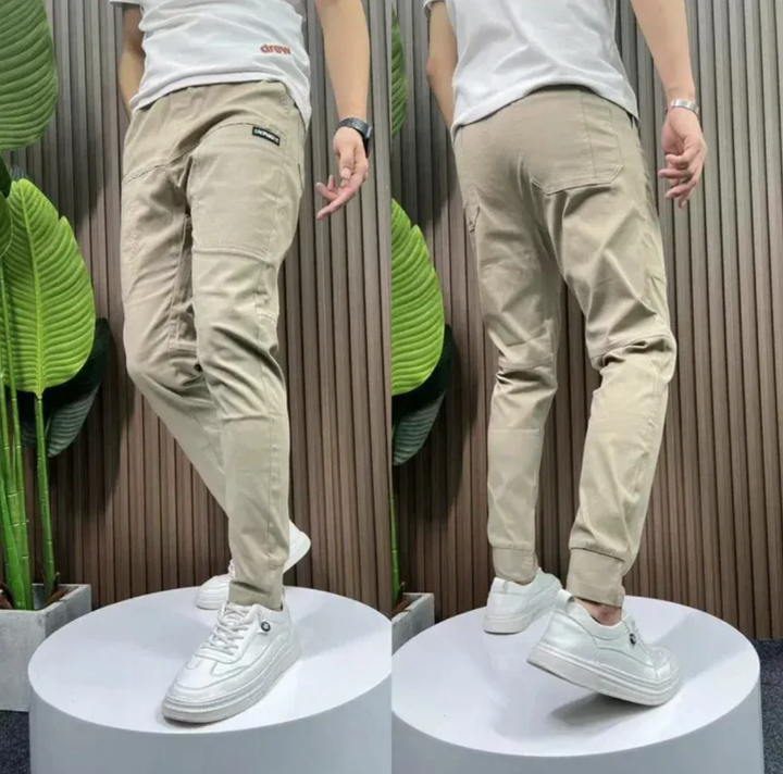 Grønne skinny herre cargobukser, funktionelle med multi-lommer og afslappet pasform for komfortabel stil.