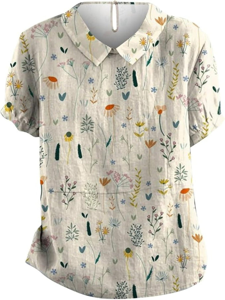 Casual dame top i hvid med blomstret print og komfortabel løs pasform. En moderne polo skjorte til hverdagsbrug.