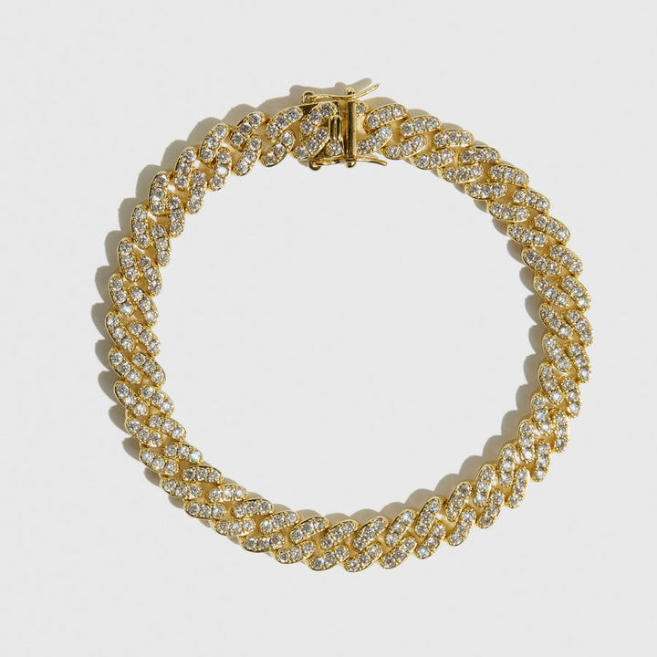 Guldfarvet fodlænke med zirkonia og Cuban link design. Tilføj elegance til dit look.