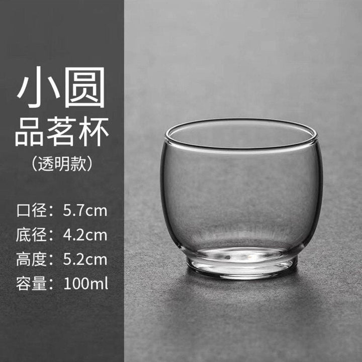 Premium glas tekande med solidt træhåndtag, designet til optimal tebrygning og elegant servering.
