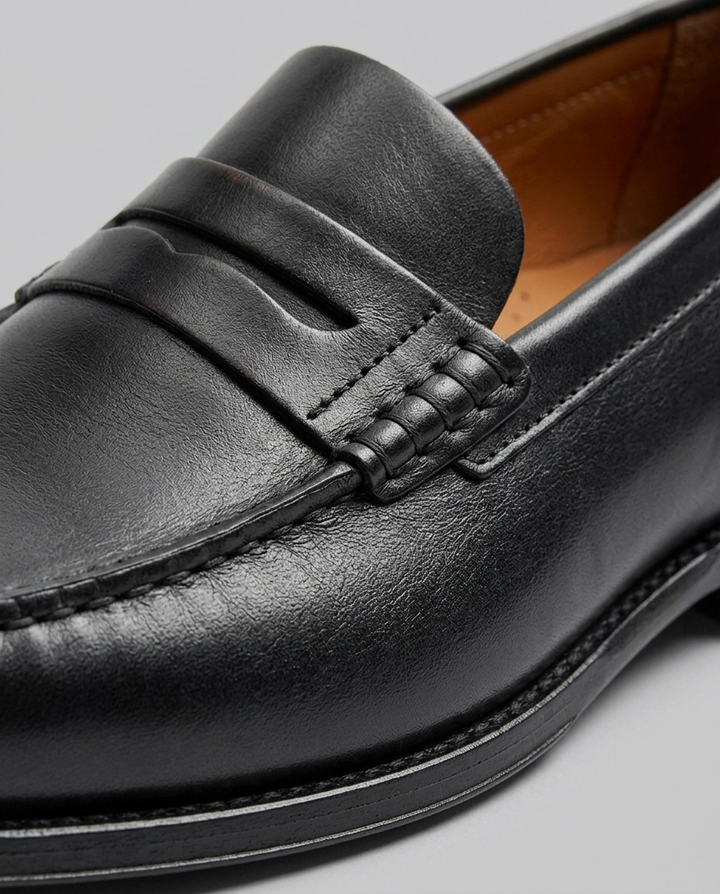 Brune herre loafers i klassisk penny-design. En komfortabel og stilfuld herresko til alle anledninger.