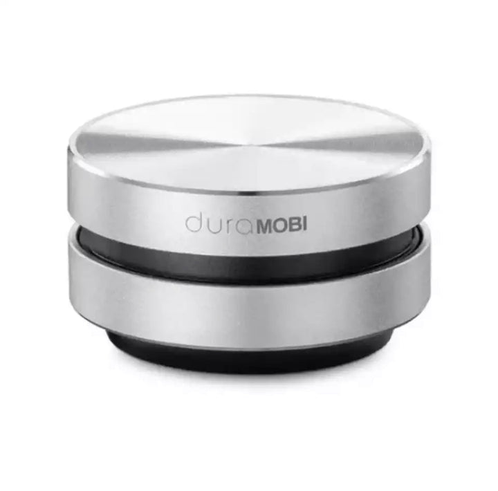 Kompakt sort Bluetooth højttaler, klar til trådløs lydoplevelse på enhver overflade.
