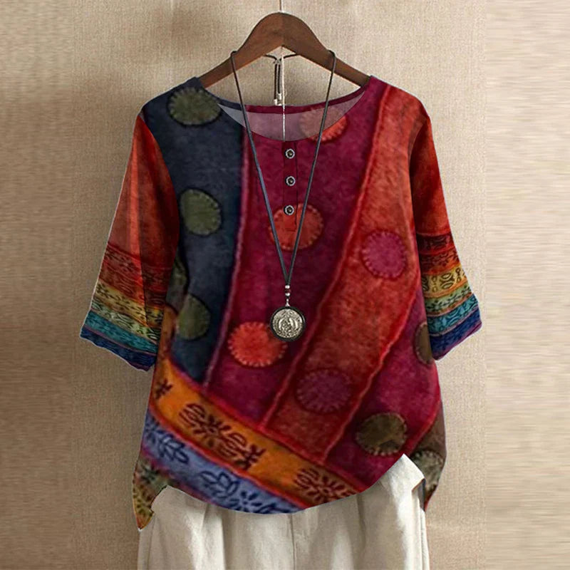Damemode: Retro blomsterbluse i afslappet pasform. Stilfuld og komfortabel forårs/sommerbluse.