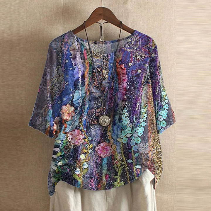 Vintage look retro blomsterbluse. Elegant kvindebluse med afslappet pasform. Damemode.