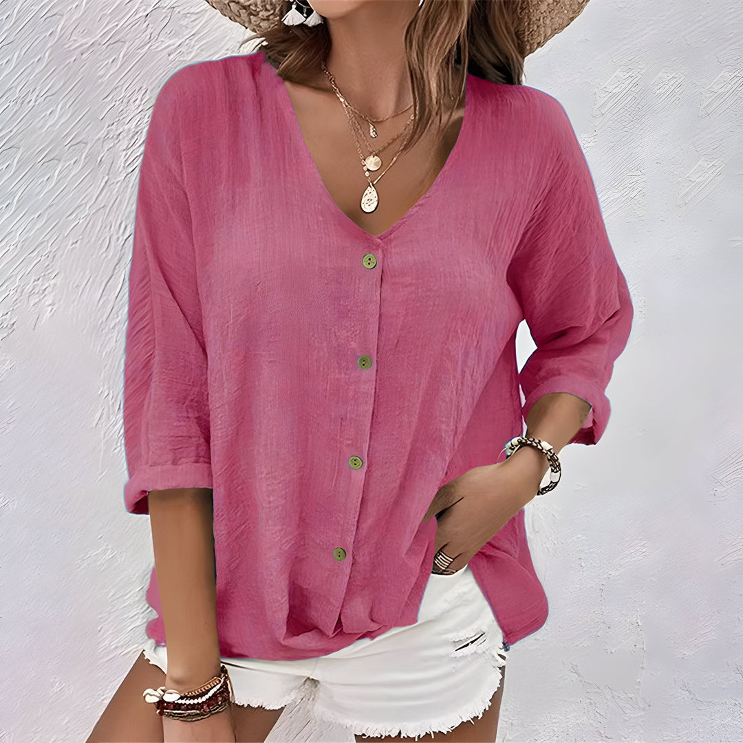 Stilfuld button-up bluse til damer med V-hals og praktiske rulleærmer for modebevidste.