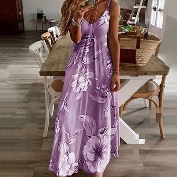 Elegant printet kjole med V-hals og ærmeløs stil. Denne løse pasform er perfekt til sommeroutfits.