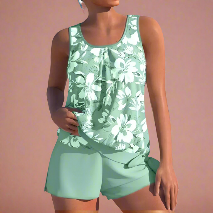 Kvinders blomstrede sommersæt med elegant top og løse shorts. Perfekt til ferie og afslappede sommerdage.