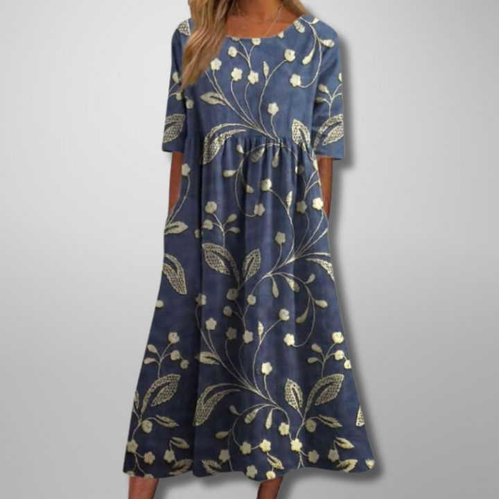 Kvinders blomstret midikjole, perfekt til både hverdag og fest, med elegant print.