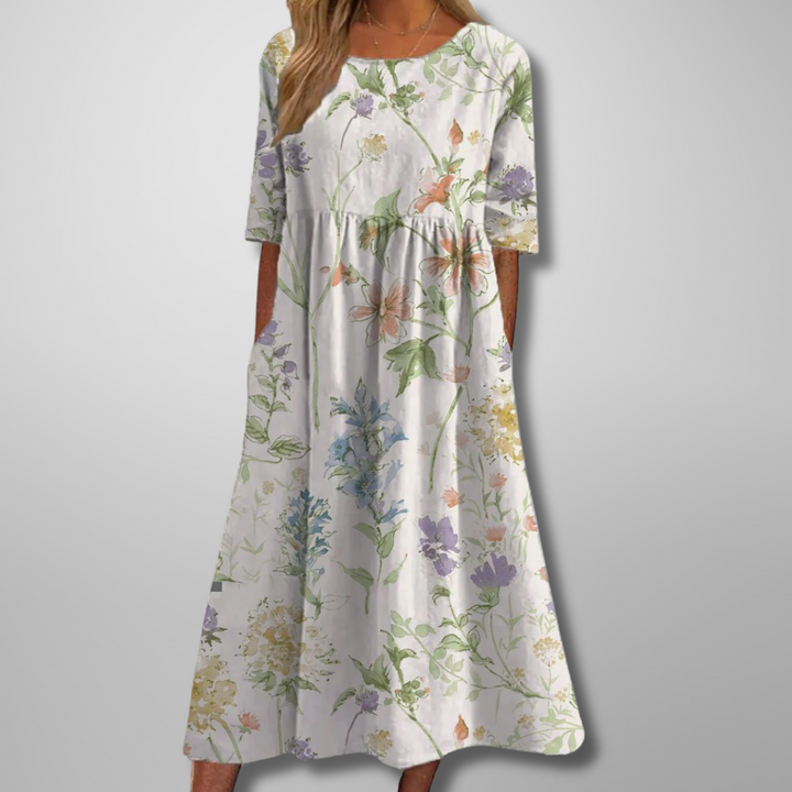 Detaljeret blomstret print på elegant midikjole til kvinder, perfekt til fest.