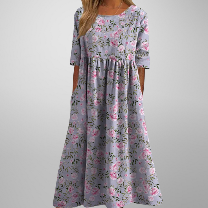 Kvinders elegante blomstrede midikjole med mønster, komfortabel til både hverdag og fest.