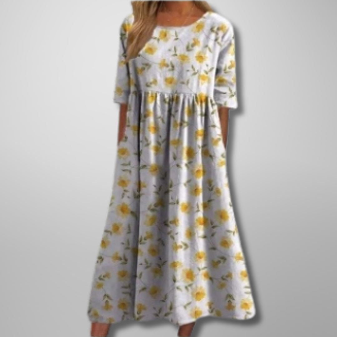 Yndefuld blomstret damekjole, afslappet og elegant midi-længde til sommerens fester og hverdag.