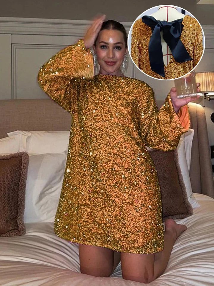 Strålende kvindekjole: paljet minikjole med elegant sløjfe og lange ærmer. Perfekt til fest og nytår.