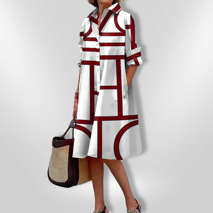 Elegant blå Helena midi kjole med geometrisk print, perfekt til både fest og hverdag. Moderne dametøj.