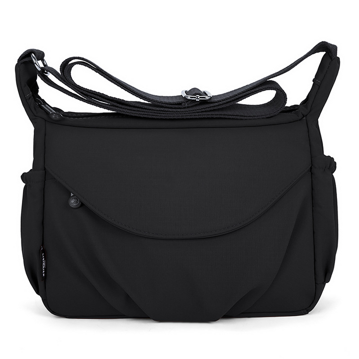 Hverdags crossbody taske i slidstærkt materiale, sikrer lang holdbarhed.