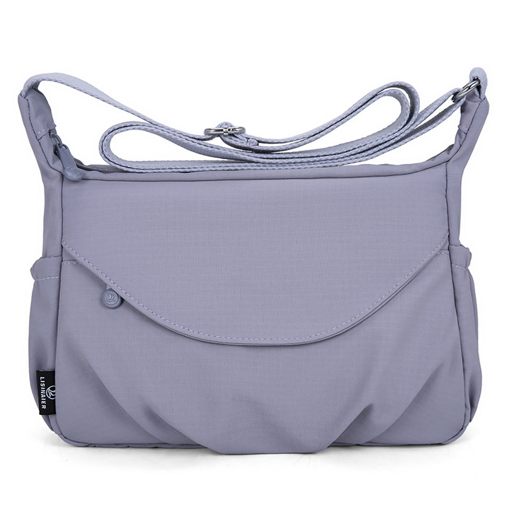 Smart crossbody kvindetaske med plads til telefon, pung og nøgler.