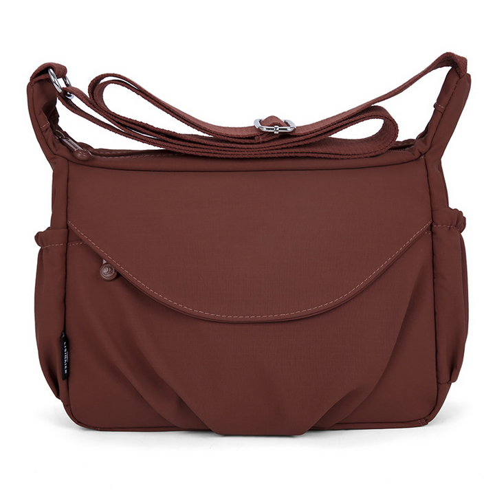 Moderne kvinders tilbehør: En funktionel og elegant crossbody taske.