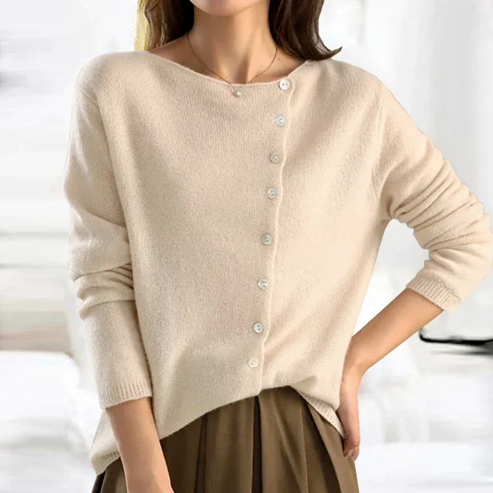 Kvinders V-hals cardigan med knapper i tidløs stil. Komfortabel og elegant til hverdagsbrug, perfekt til lag-på-lag.