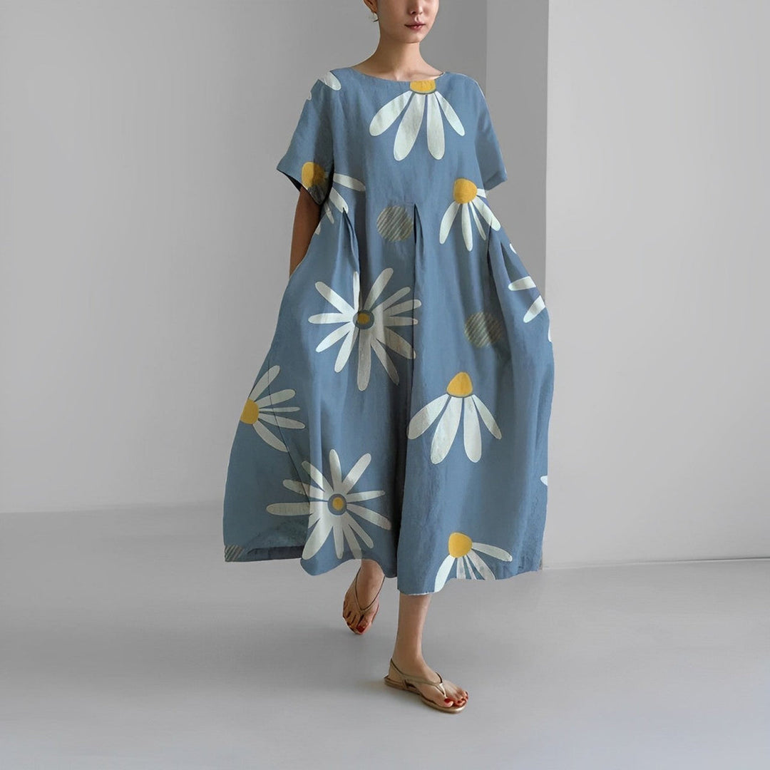 Levende farverig blomstret løstsiddende kjole til damer, med boho chic flair. Komfortabel og let.