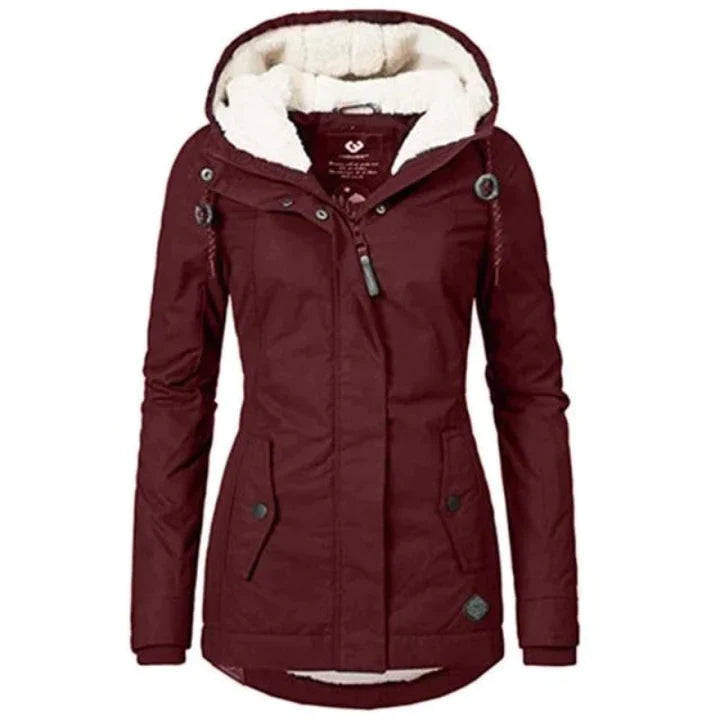 Lang dame vinterparka i elegant design, perfekt til stilfuld vintermode og kolde dage.