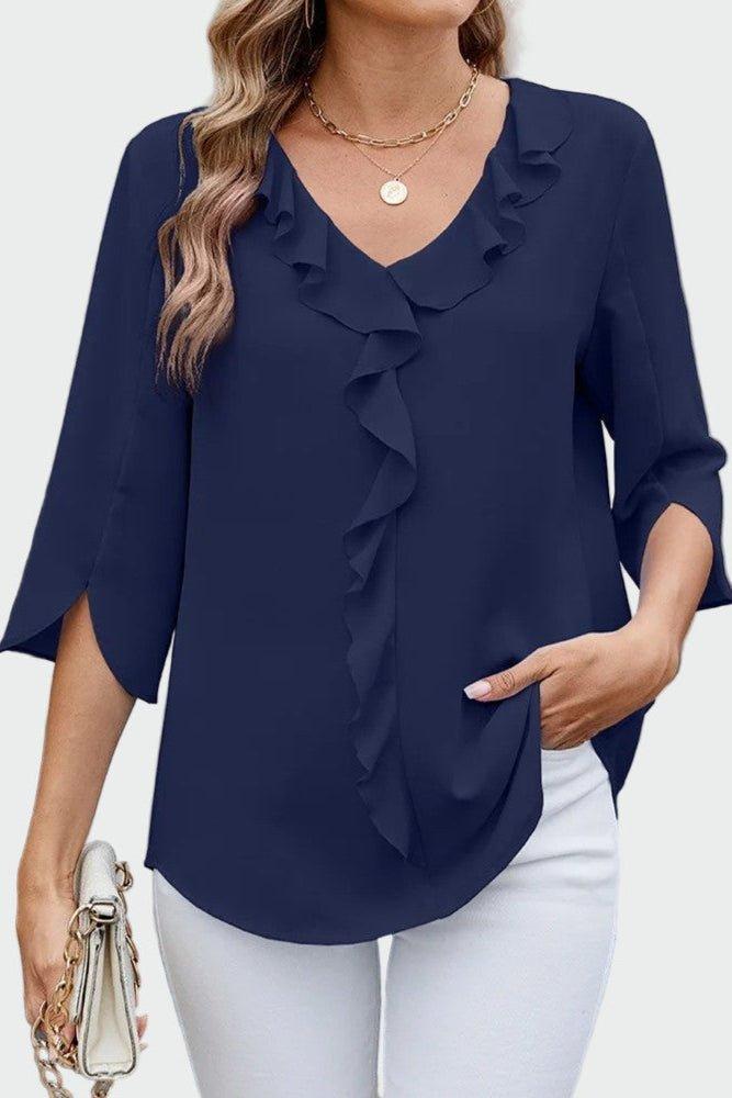 Stilfuld dame top med flæsedetaljer, trekvart ærmer & løs pasform. Perfekt som feminin hverdagsbluse.