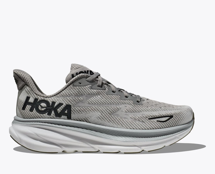 Lette herresko i grå og blå med hvid sål, Hoka Clifton 9, designet til optimal komfort og stødabsorbering.