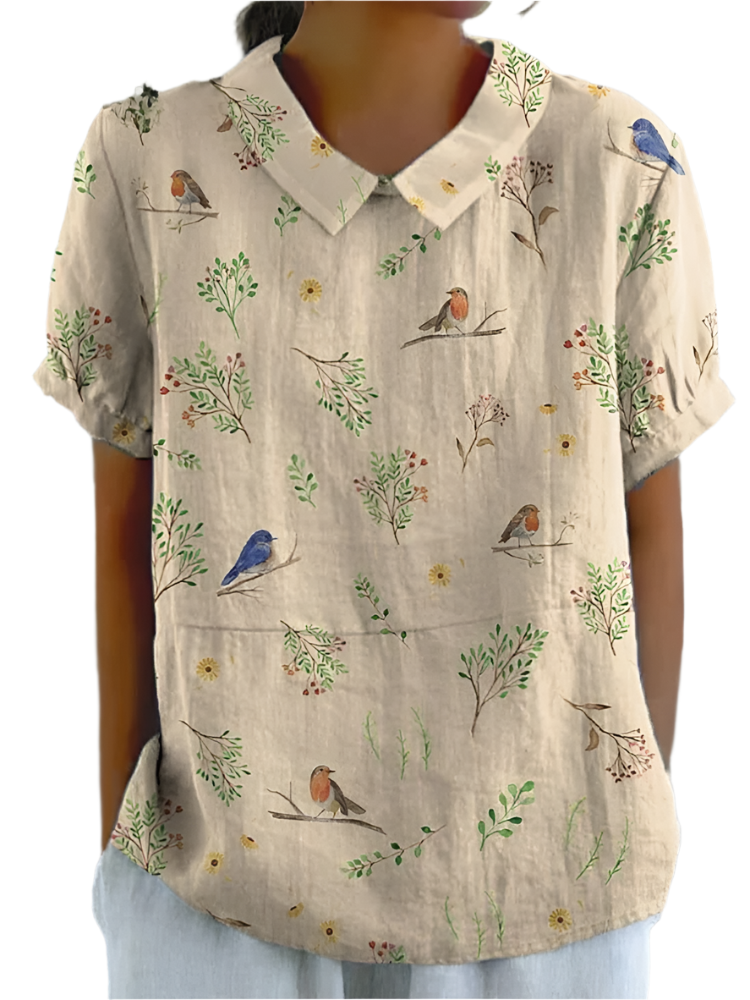 Luftig damebluse med rødkælk design, naturprint med grene og fugle, sommerlig elegance til kvinder.
