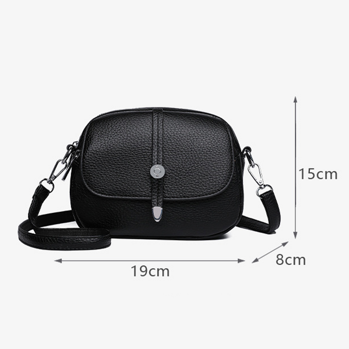 Nærbillede af vandafvisende stof på LumaCarry crossover taske i sort. Holdbar nylon.