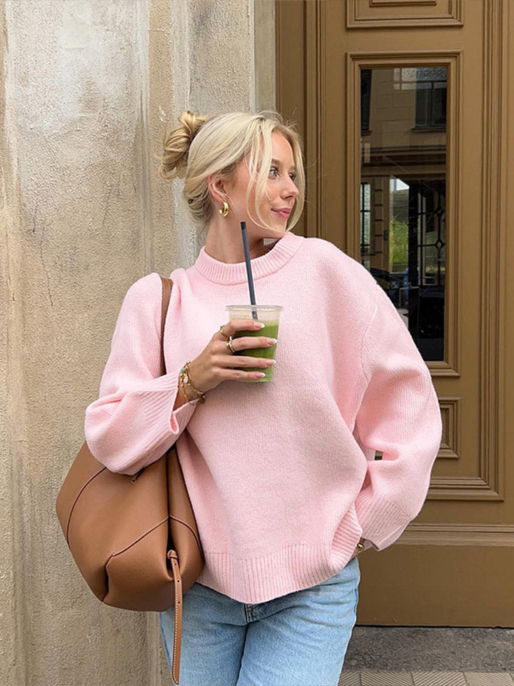 Alsidig dame sweater i lyserød med løs pasform, langærmet og rund hals. Ideel som hverdagstøj og vintermode.