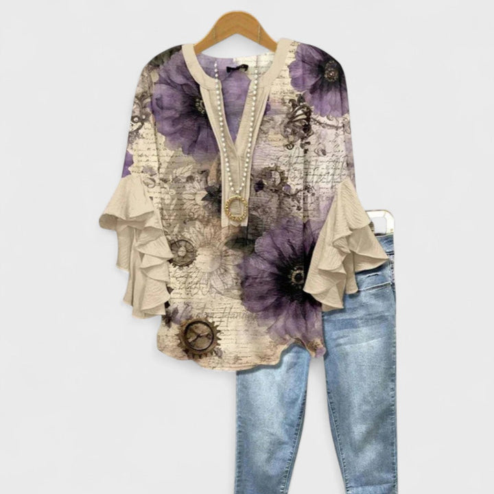 Stribet letvægtsbluse til kvinder. Afslappet og elegant sommerbluse i blødt materiale.