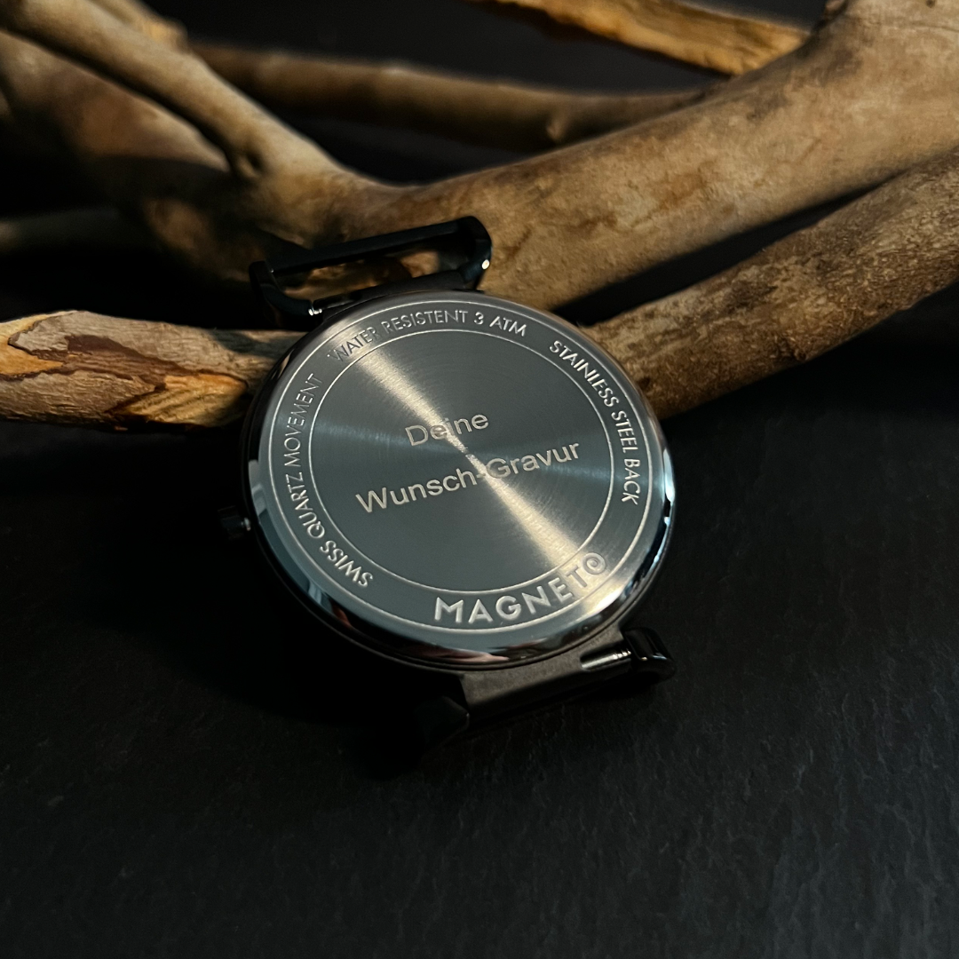 Gaveidé: Moderne unisex magnetisk kugleur med unikt design og mesh armbånd.