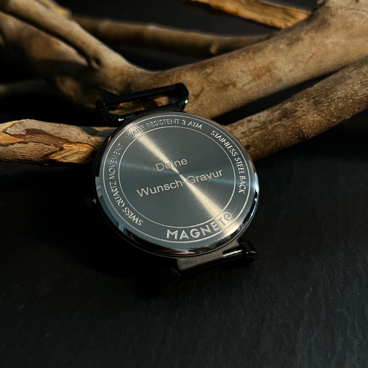 Gaveidé: Moderne unisex magnetisk kugleur med unikt design og mesh armbånd.