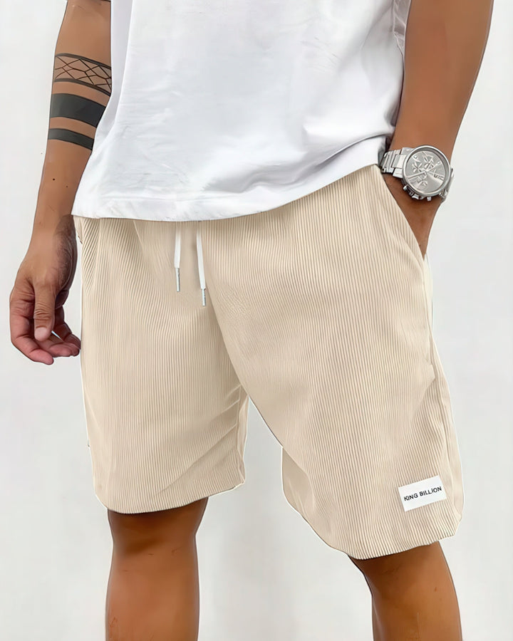 Nærbillede af tekstur på Kasper herre shorts; løs pasform, komfortable til hverdag og sommer.