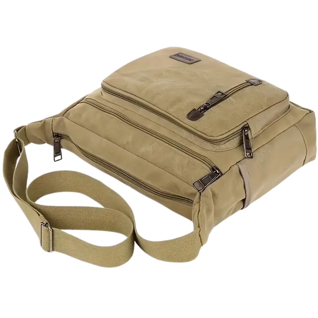 "Outdoor skuldertaske, rummelig og slidstærk i armygrøn. Perfekt til rejser, med justerbar skulderrem og unisex stil."